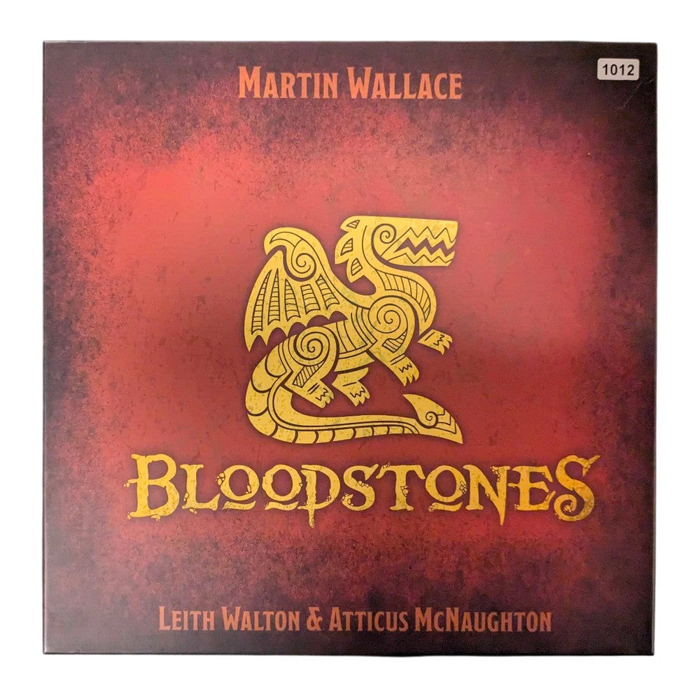 BLOODSTONES board game box with a gold stylized dragon on a red and black background, by Martin Wallace.