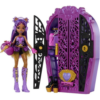 Purple-haired Monster High Clawdeen Wolf doll in a purple and gold outfit, holding a purse and key, stands next to an open ornate purple coffin wardrobe displaying accessories