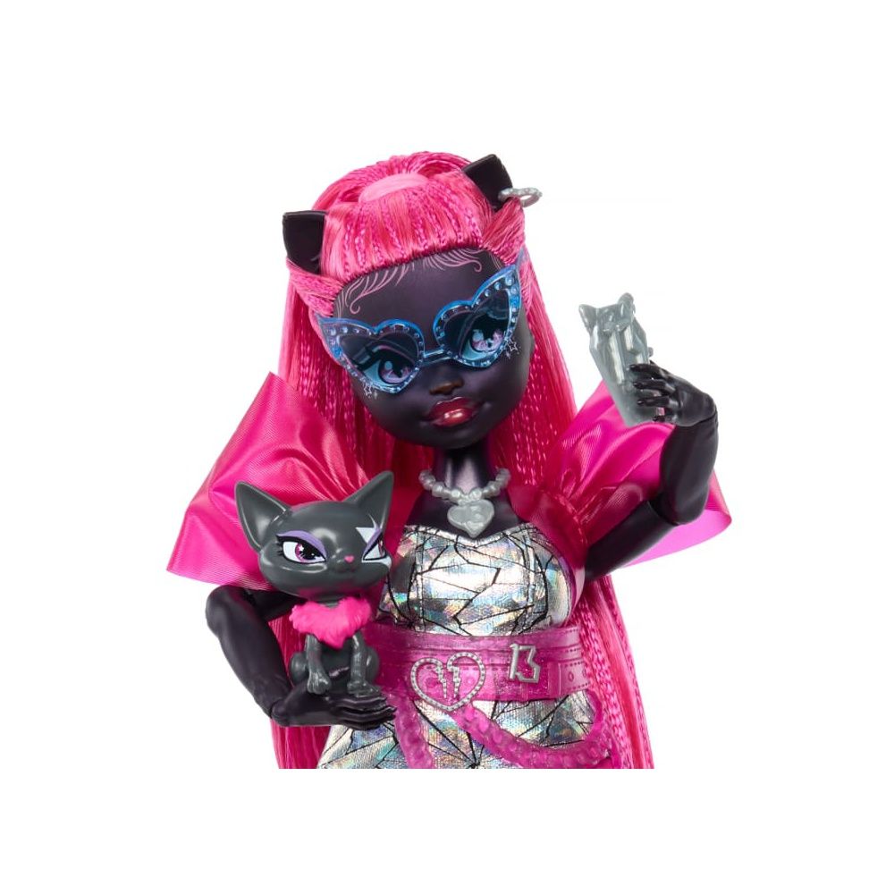 She holds a grey cat and a clear cat-shaped phone