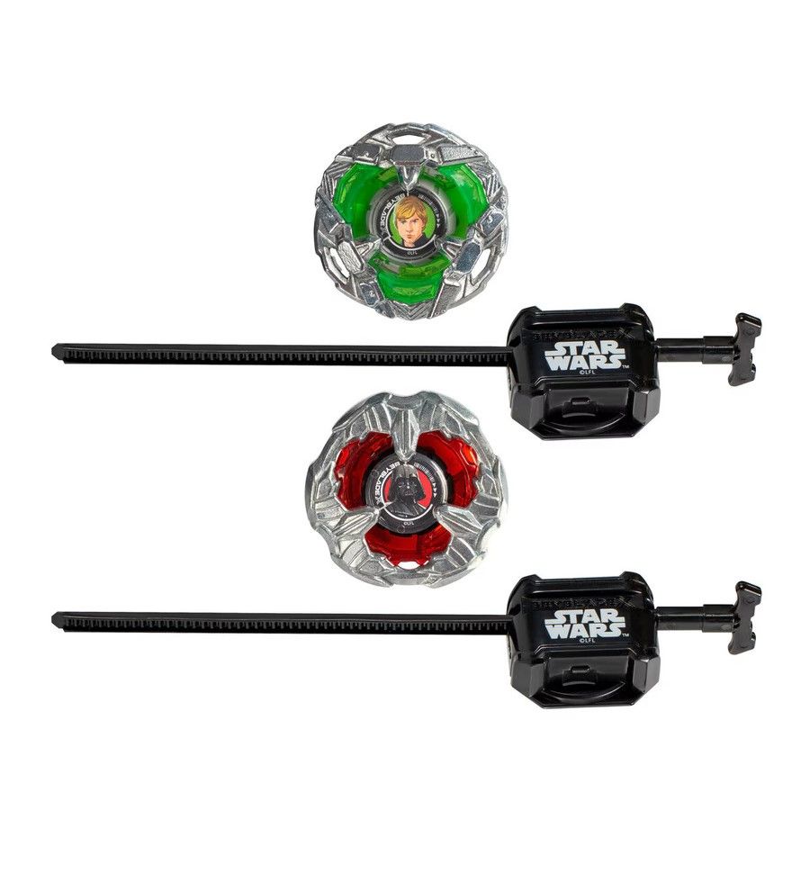 Two Star Wars spinning top toys with launchers: a green Luke Skywalker top and a red Darth Vader top