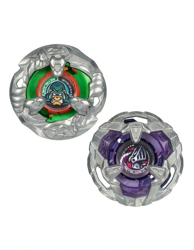Two Beyblade spinning tops on white: one green with a gorilla emblem, one purple with a wolf-like design