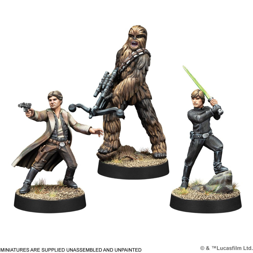 Painted Star Wars miniatures: Han Solo (blaster), Chewbacca (bowcaster), and Luke Skywalker (lightsaber)