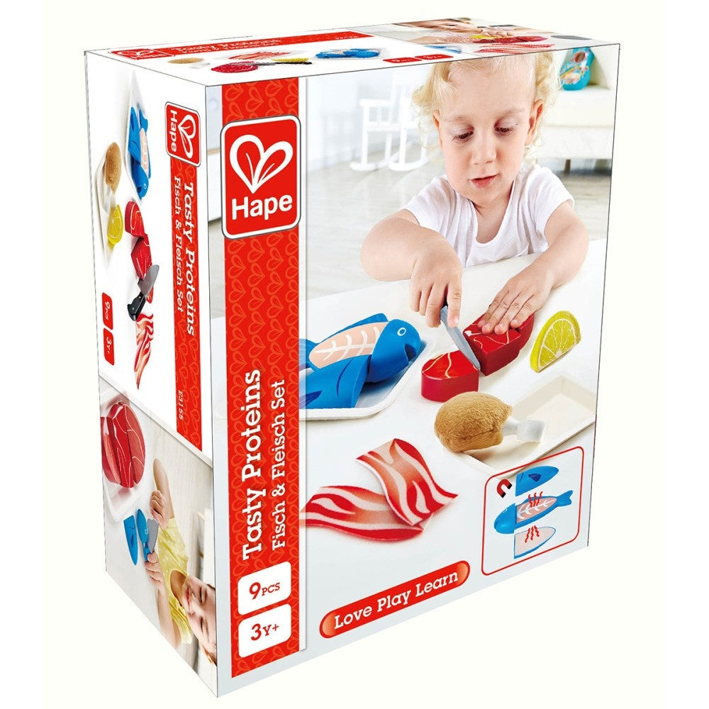Product box for Hape's "Tasty Proteins" play food. A child cuts toy steak with a knife; toy fish, chicken, bacon on table.