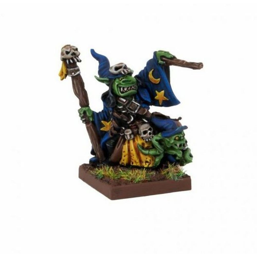 A miniature of a green-skinned goblin wizard in blue robes and a star-moon hat, holding a skull staff