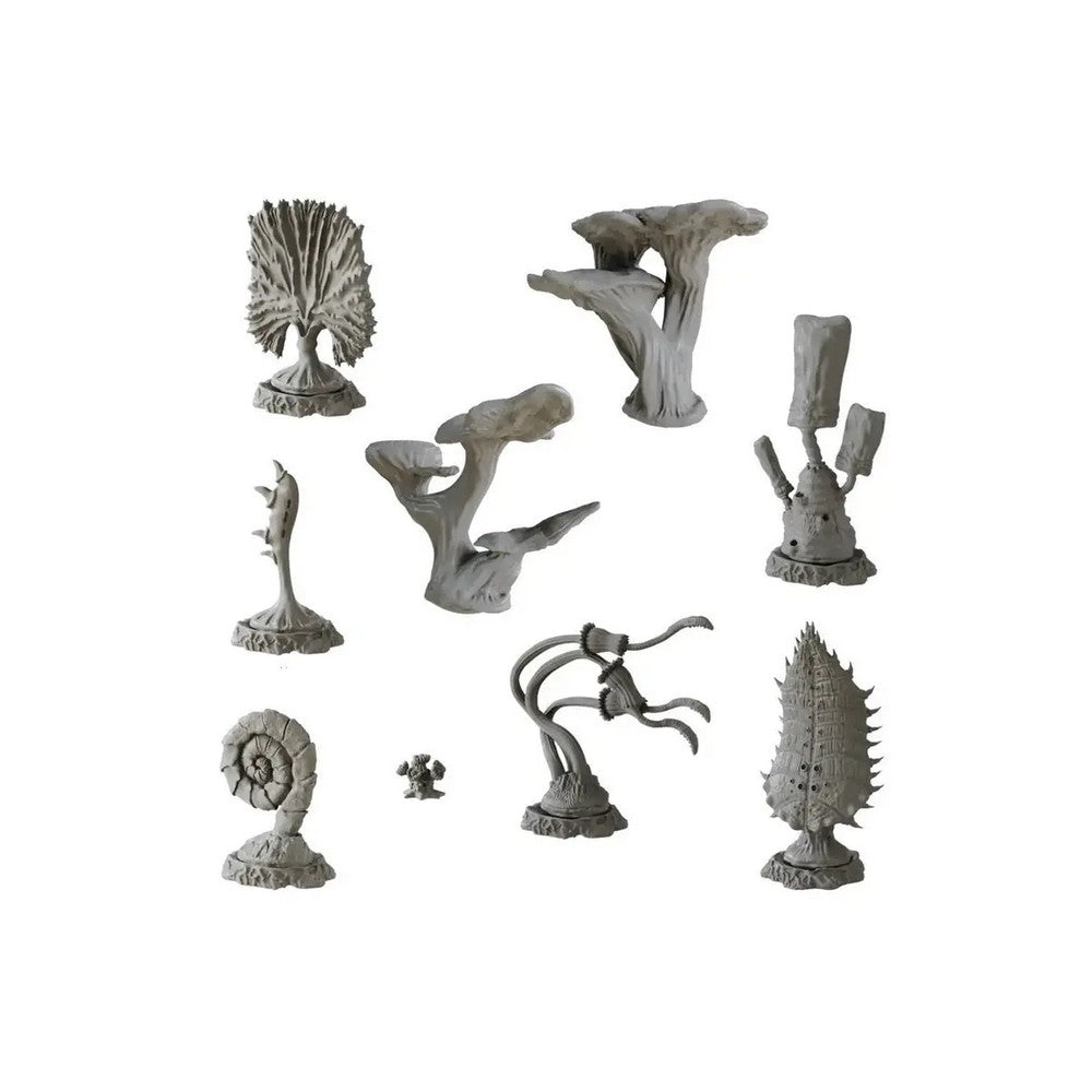 Various unpainted grey alien flora miniatures on a white background. They resemble strange trees, mushrooms, and organic structures.