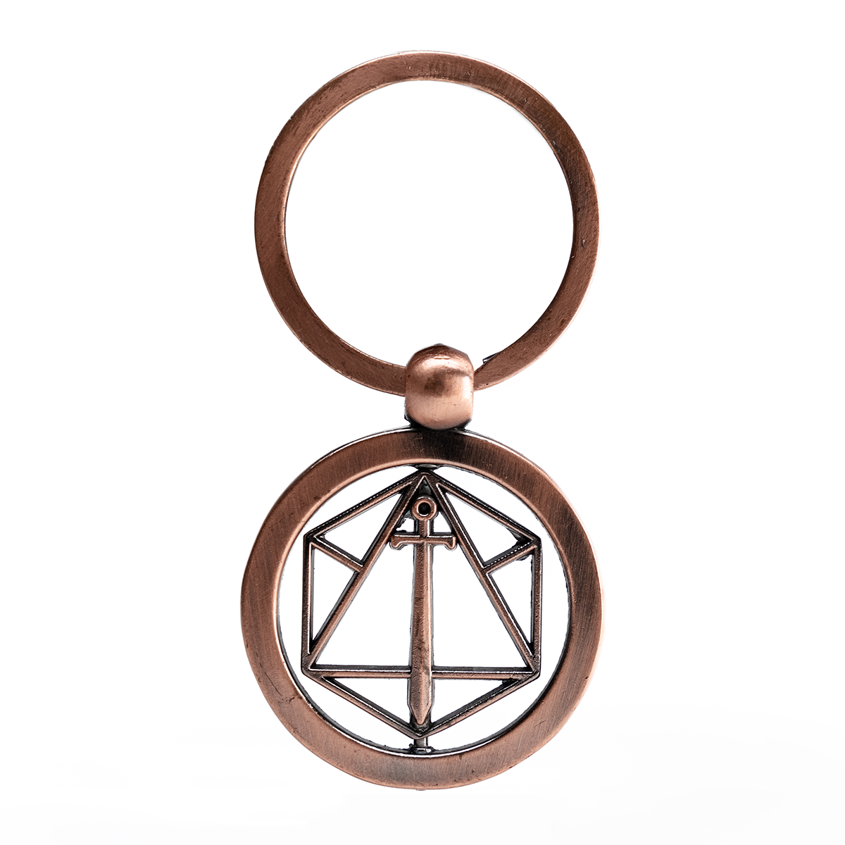 An antique copper spinning keychain with a circular pendant featuring a geometric d20 outline and a vertical sword
