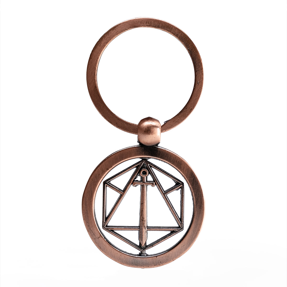 An antique copper spinning keychain with a circular pendant featuring a geometric d20 outline and a vertical sword