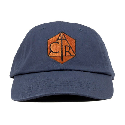 A dark blue Critical Role Critter cap with an orange embroidered CTR/sword logo in a hexagon