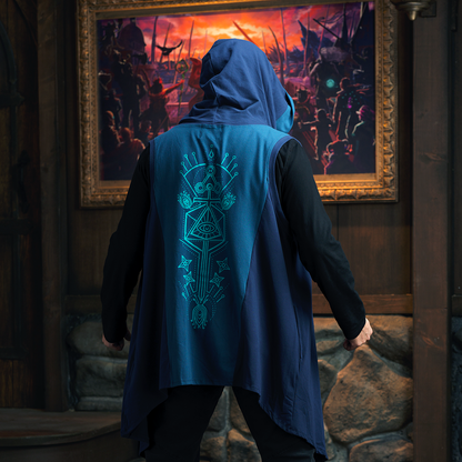 Person from behind in a hooded blue vest with a geometric eye design, looking at a large painting of an orange-skied battle