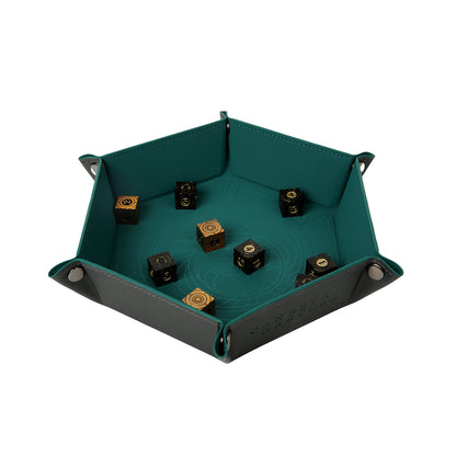 Hexagonal teal & grey dice tray holding 8 ornate black and gold metal dice. "Candela Obscura" is visible on the side
