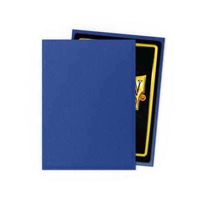 Blue matte trading card sleeve protecting a partially visible game card with a black background and gold border