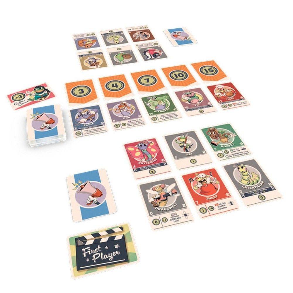 Colorful animal-themed playing cards and numbered score cards laid out, including a "First Player" token