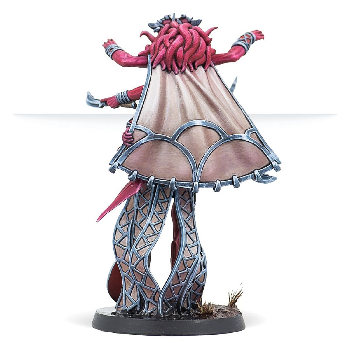 Painted miniature of a red daemon-like figure spreading arms, draped in a large cape, and standing on lattice-work legs