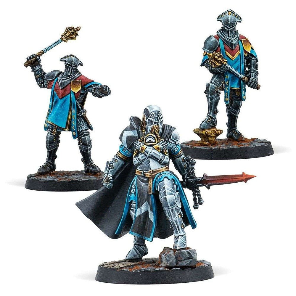 Three hand-painted tabletop miniatures of armored knights wearing blue and silver, holding a sword and maces