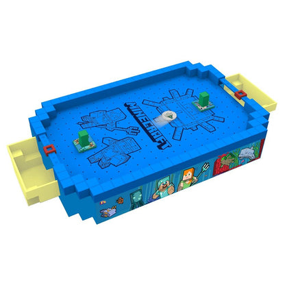 A blocky blue Minecraft tabletop game, resembling air hockey, with green obstacles and yellow goals