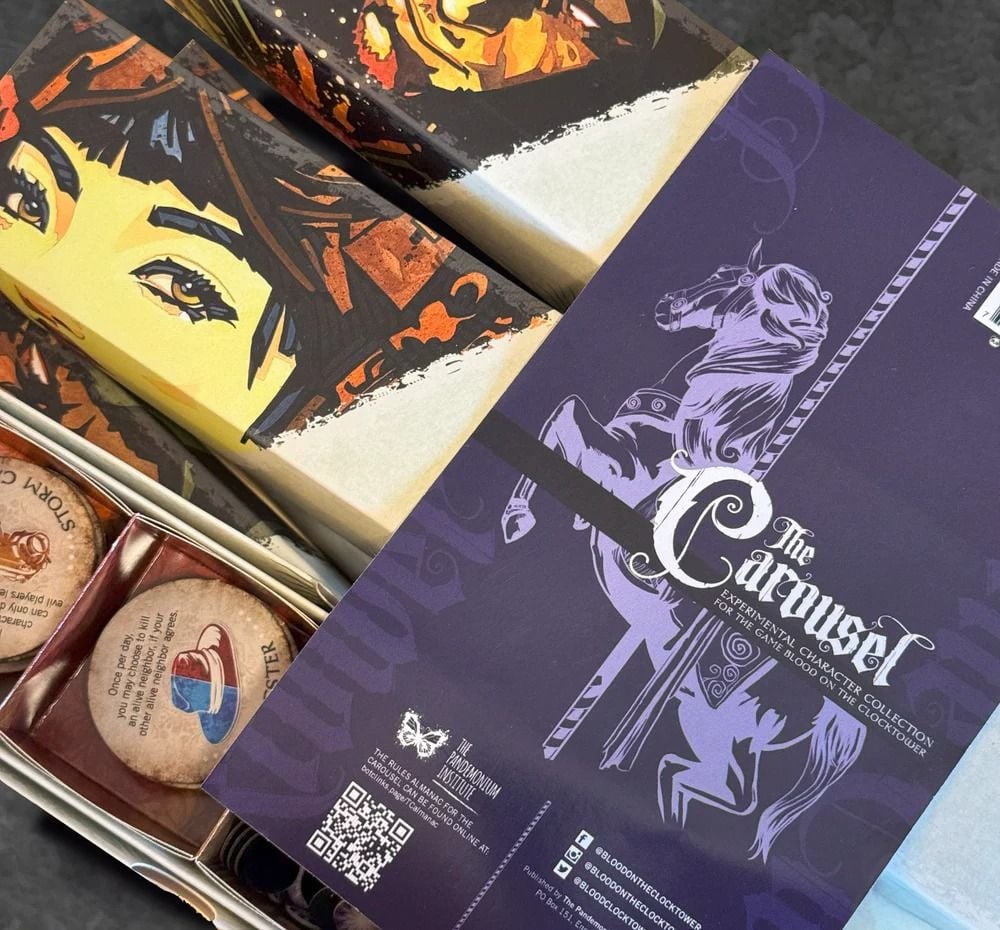 A close-up of Blood on the Clocktower The Carousel expansion with its purple booklet, game tokens, and stylized character box art