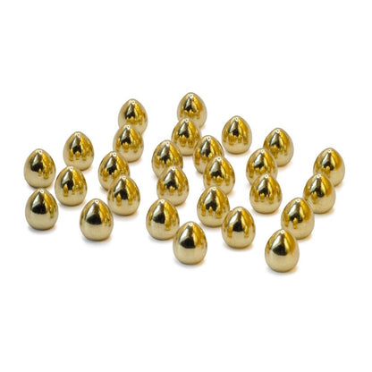 Several shiny metallic gold conical studs scattered on a white surface
