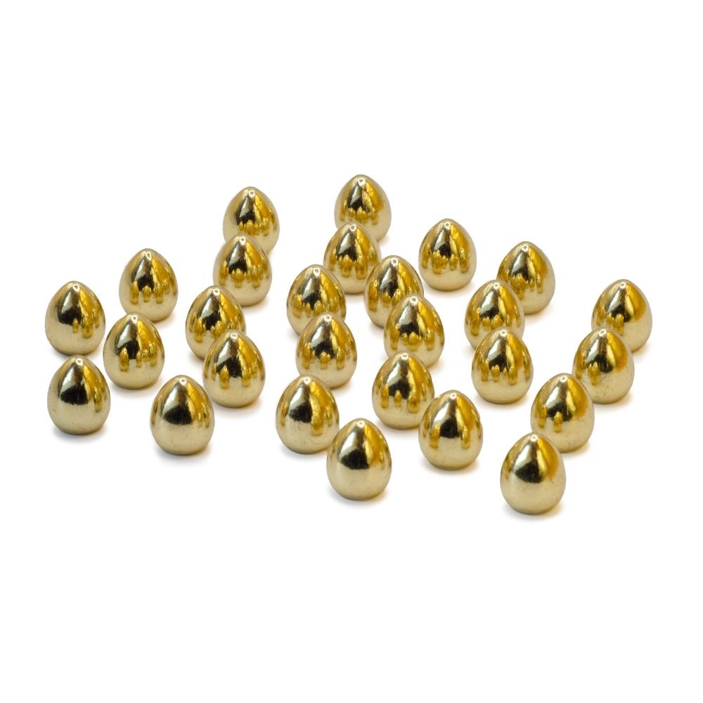 Several shiny metallic gold conical studs scattered on a white surface