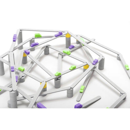 Complex toy structure of interlocking gray roads, supported by pillars, with small green and purple cars