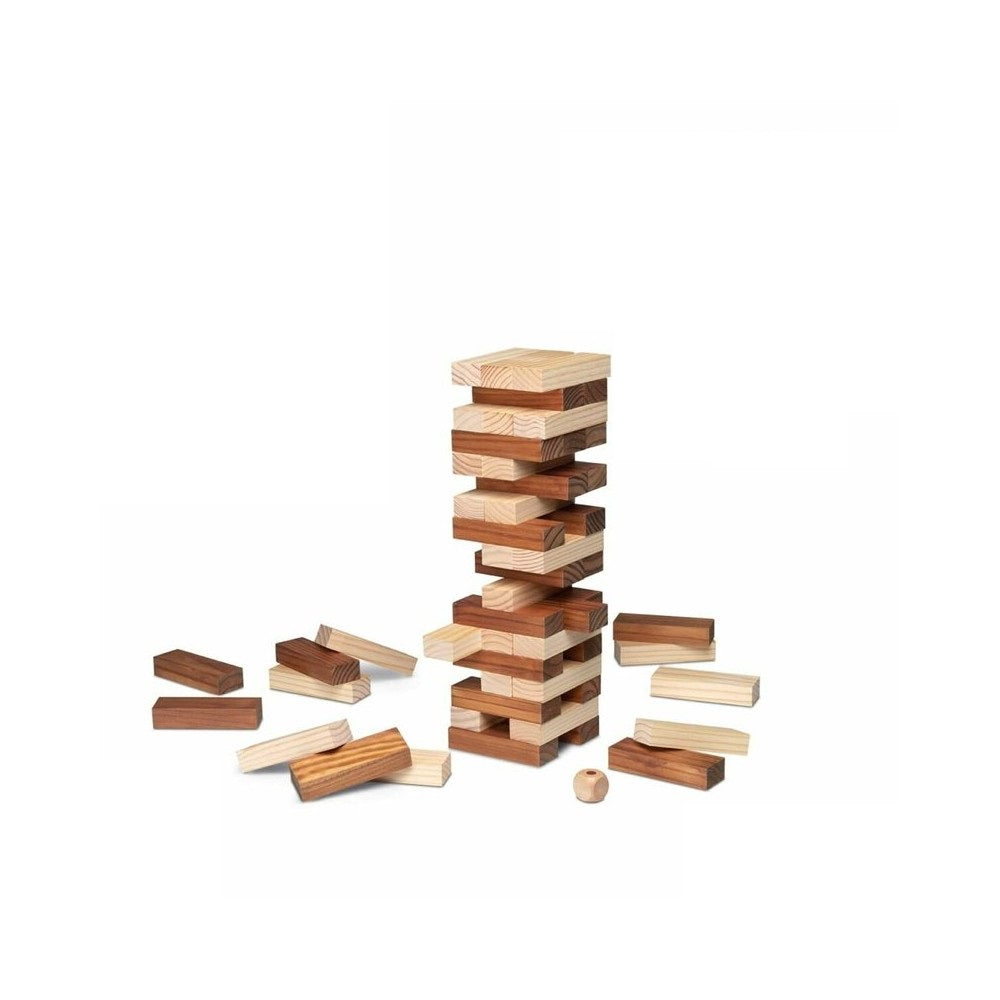 Unstable tower of alternating light and dark wooden blocks (Jenga game) with scattered pieces on white