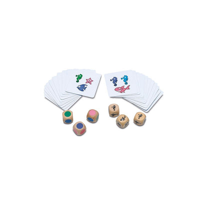 Board game set with six wooden dice and stacks of cards showing colorful sea animal illustrations