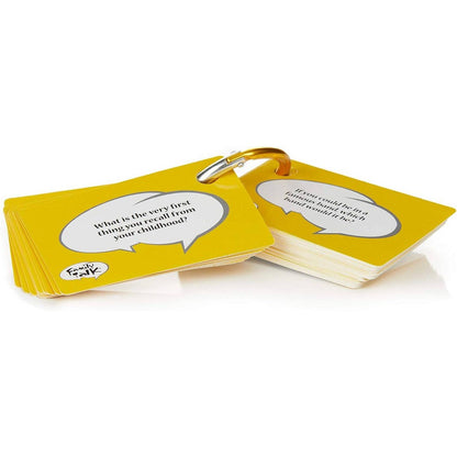 Yellow Family Talk conversation prompt cards are secured by a silver carabiner clip displaying questions in white speech bubbles like those recalling childhood memories