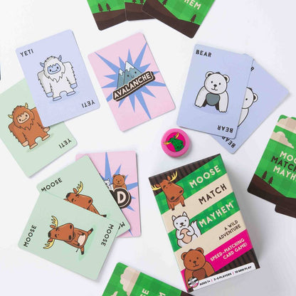 Colorful cards and the box for the Moose Match Mayhem speed-matching game, featuring cartoon animals