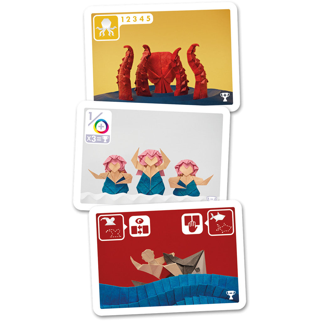 Three stacked nautical-themed game cards featuring colourful origami figures: a kraken monster, three mermaids, and a sailor in a boat
