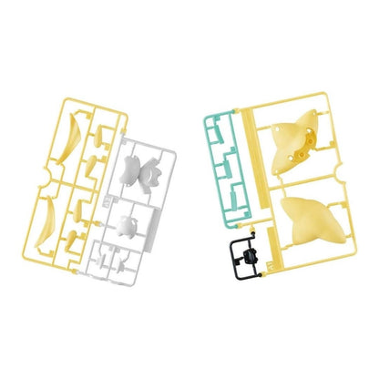 Unassembled plastic model kit sprues, featuring yellow, white, teal, and black runners with parts on a white background