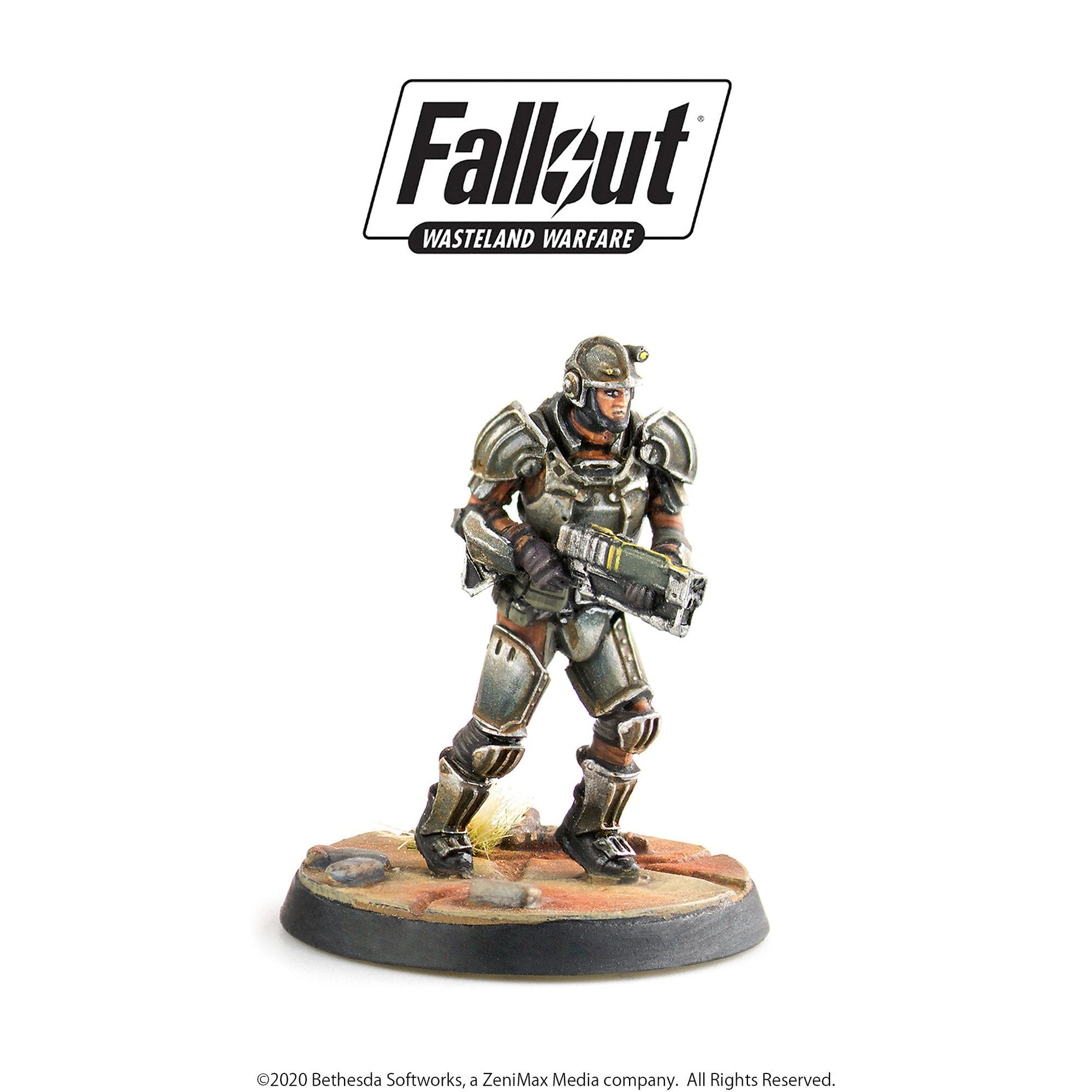 Fallout Wasteland Warfare miniature: armored soldier with helmet and headlamp, holding a rifle on a desert base