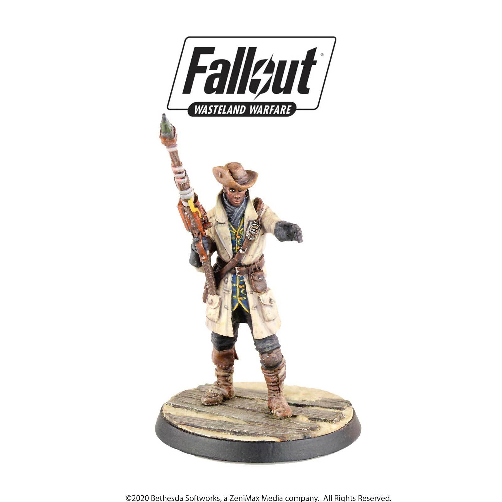 Fallout Wasteland Warfare miniature of a cowboy-hatted figure in a long coat, holding a distinct rifle and pointing