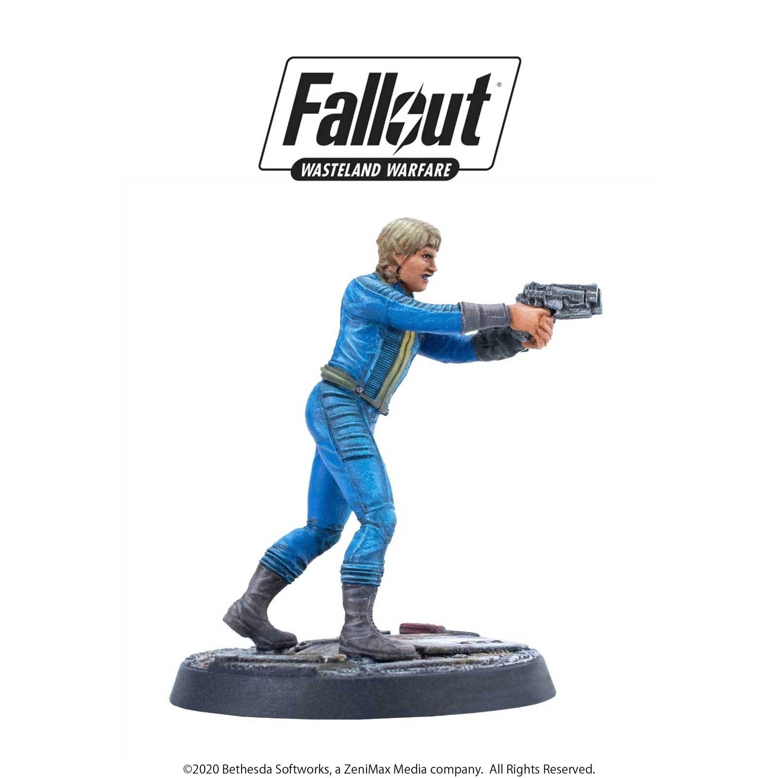 Fallout Wasteland Warfare miniature: A blonde female Vault Dweller in a blue suit, aiming a pistol