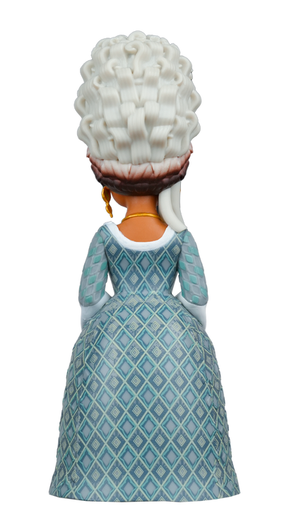 Rear view of a MINIX Bridgerton Queen Charlotte Figure featuring an elaborate white wig, gold jewelry, and a blue dress with a diamond pattern