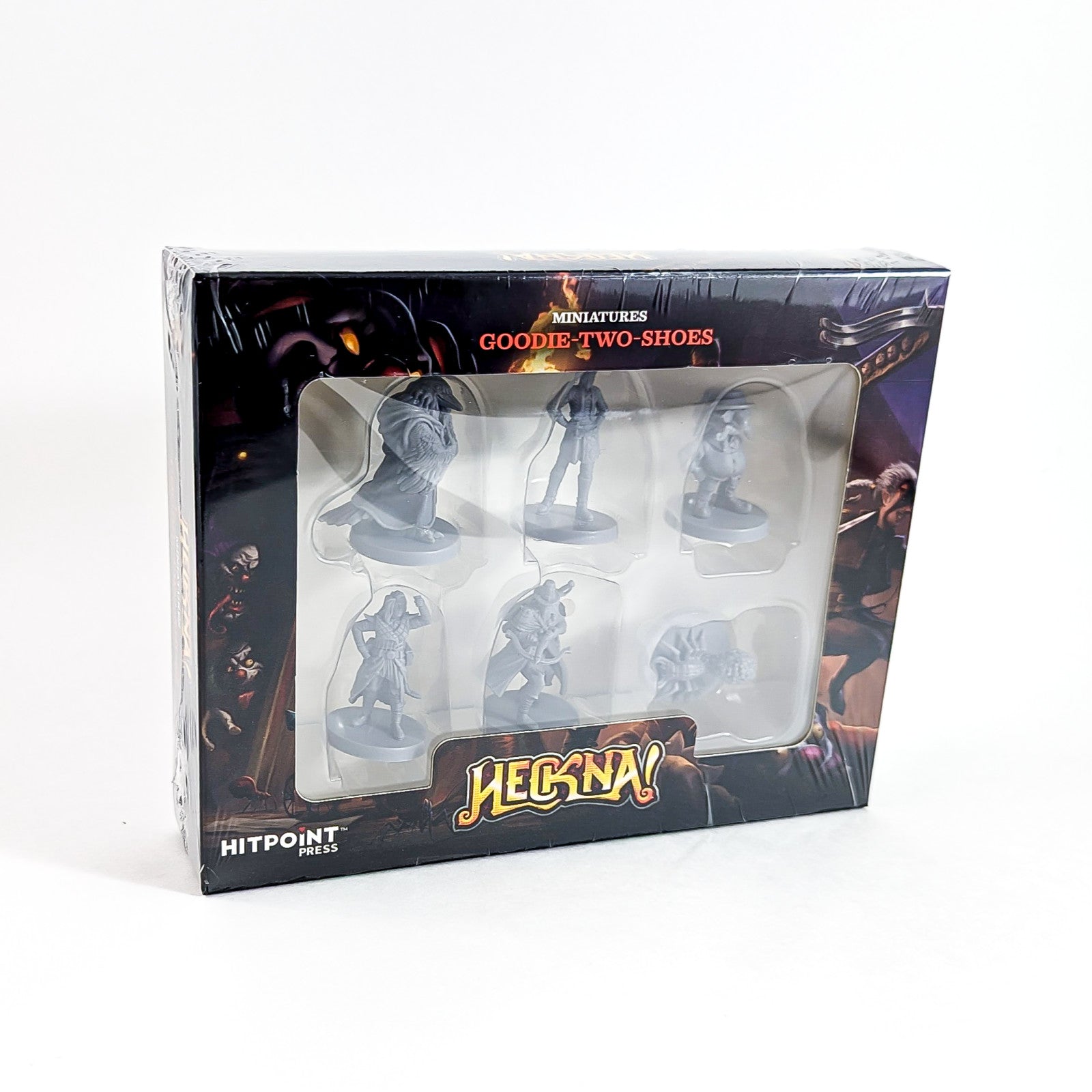 A black retail box for "Heckna! Goodie-Two-Shoes Miniatures" displaying six unpainted grey fantasy figures.