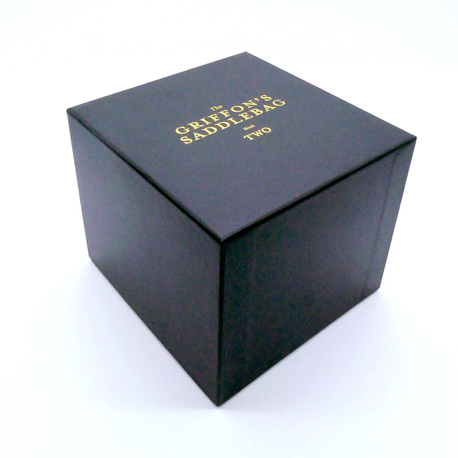Black box with gold text "The Griffon's Saddlebag Book Two" on its lid.