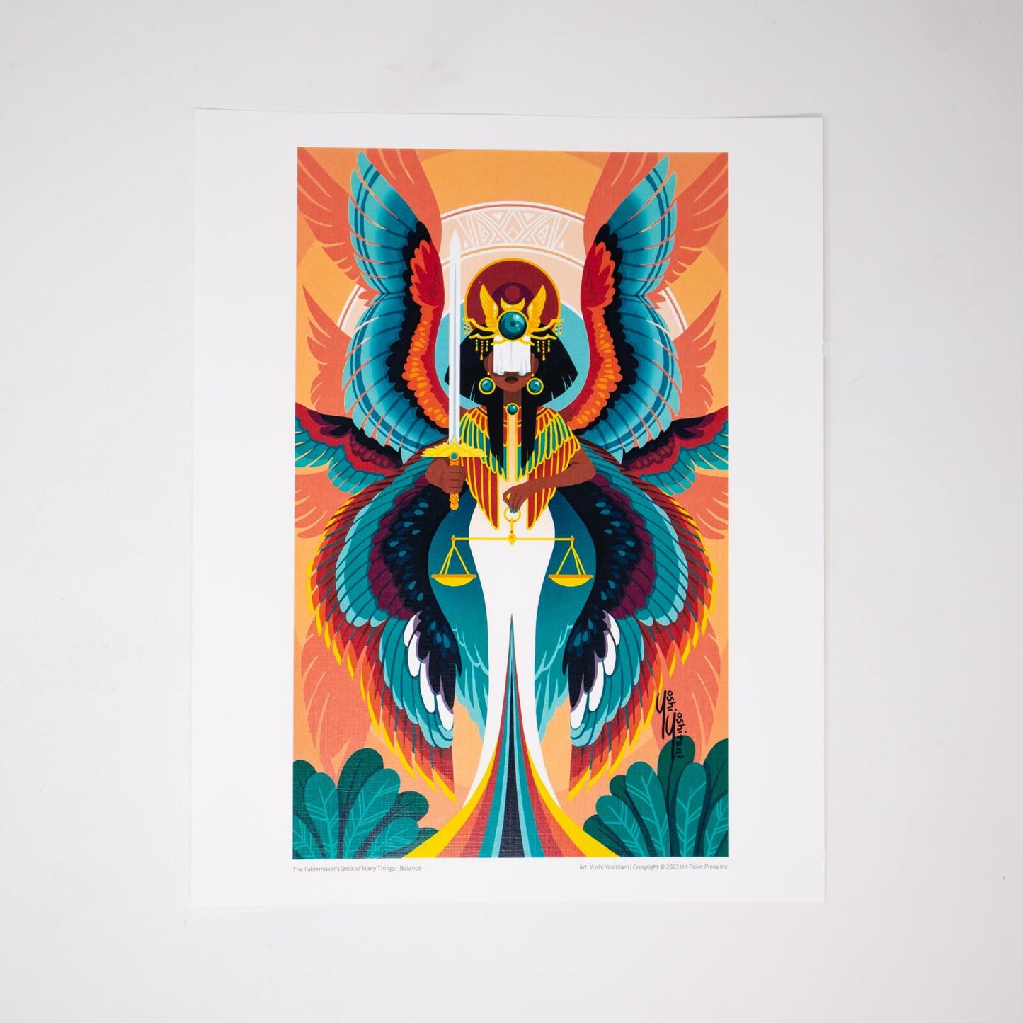 Stylized winged woman in Egyptian headdress, holding a sword and scales. Vibrant teal and red wings against an orange background