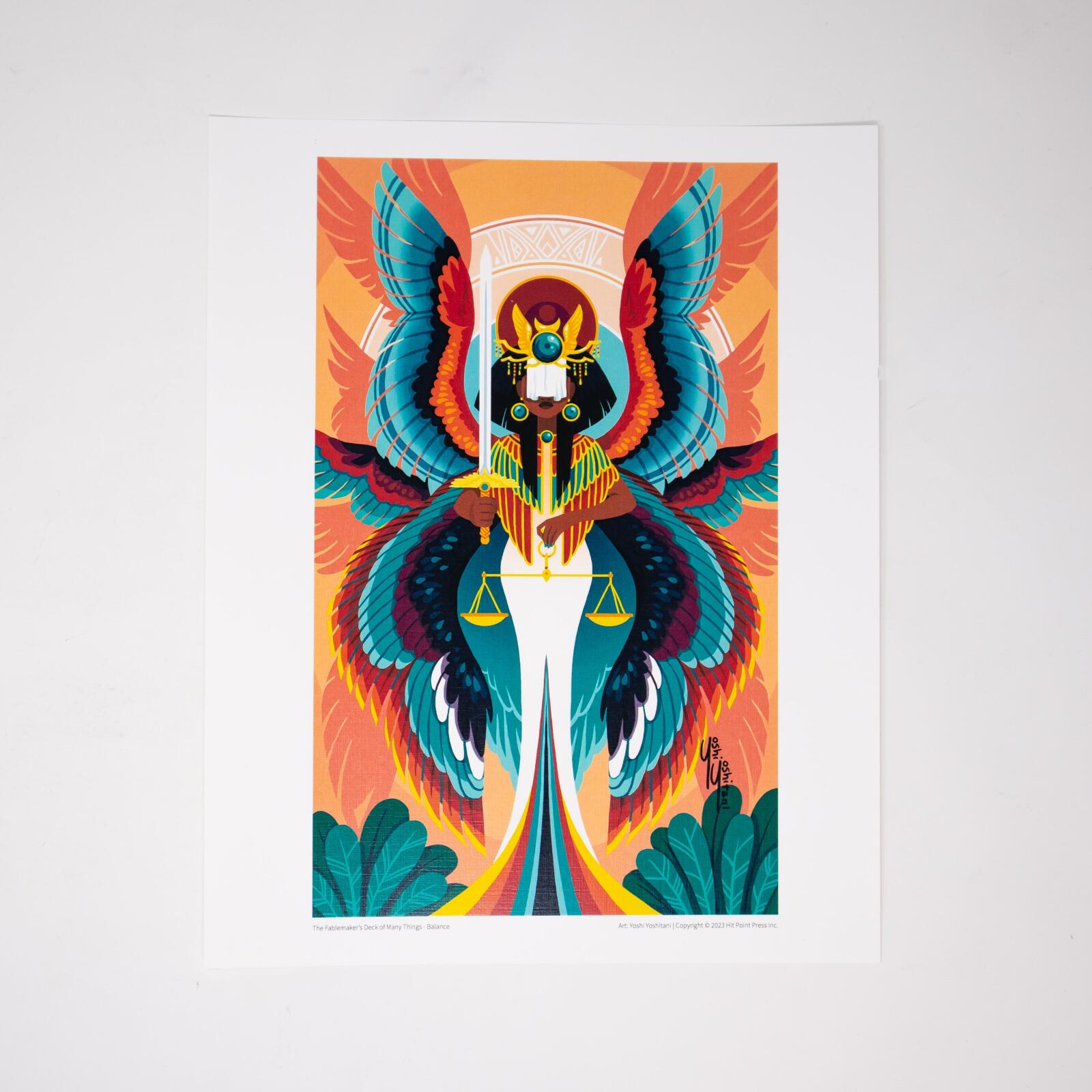 Stylized winged woman in Egyptian headdress, holding a sword and scales. Vibrant teal and red wings against an orange background