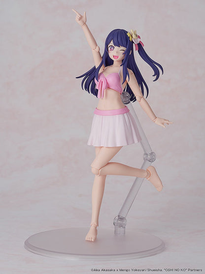 Articulated figure of a smiling, winking purple-haired girl in a pink bikini top and white skirt, pointing up