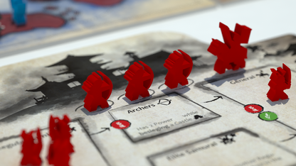 Red game pieces, including archers and a general, on a board game map with a Japanese castle illustration and rule text