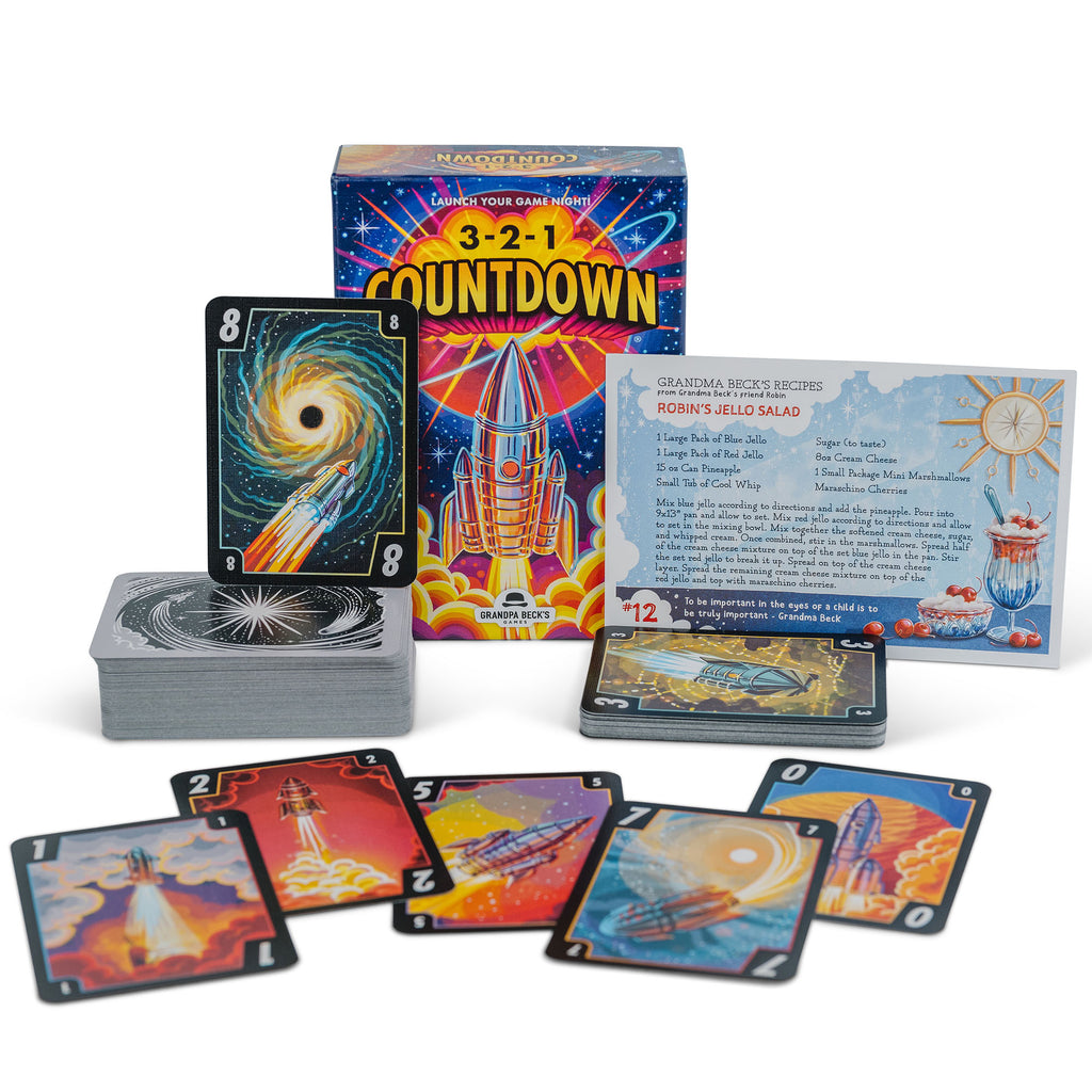 3-2-1 Countdown board game box with vibrant rocket ship art recipe card for Robin&#39;s Jello Salad and space-themed playing cards spread out