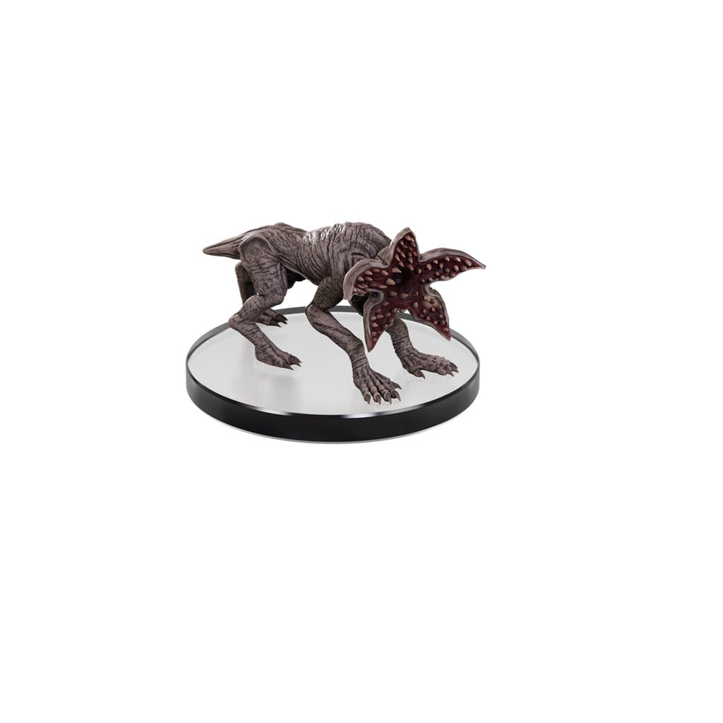 Crouching Demogorgon figurine from Stranger Things with its star-shaped mouth open, displayed on a stand