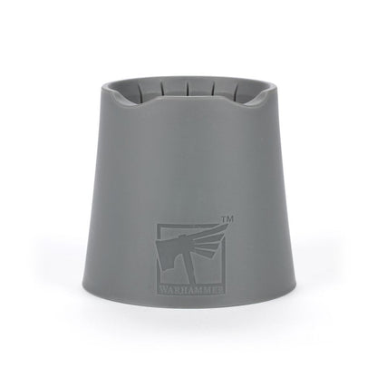 Gray Warhammer water pot holder or sprue catcher tool with recessed top slots, featuring the embossed logo