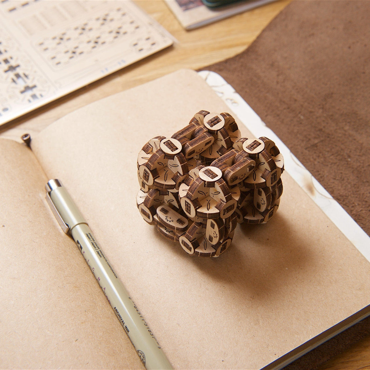 Detailed view of Ugears model&#39;s wooden gear assembly