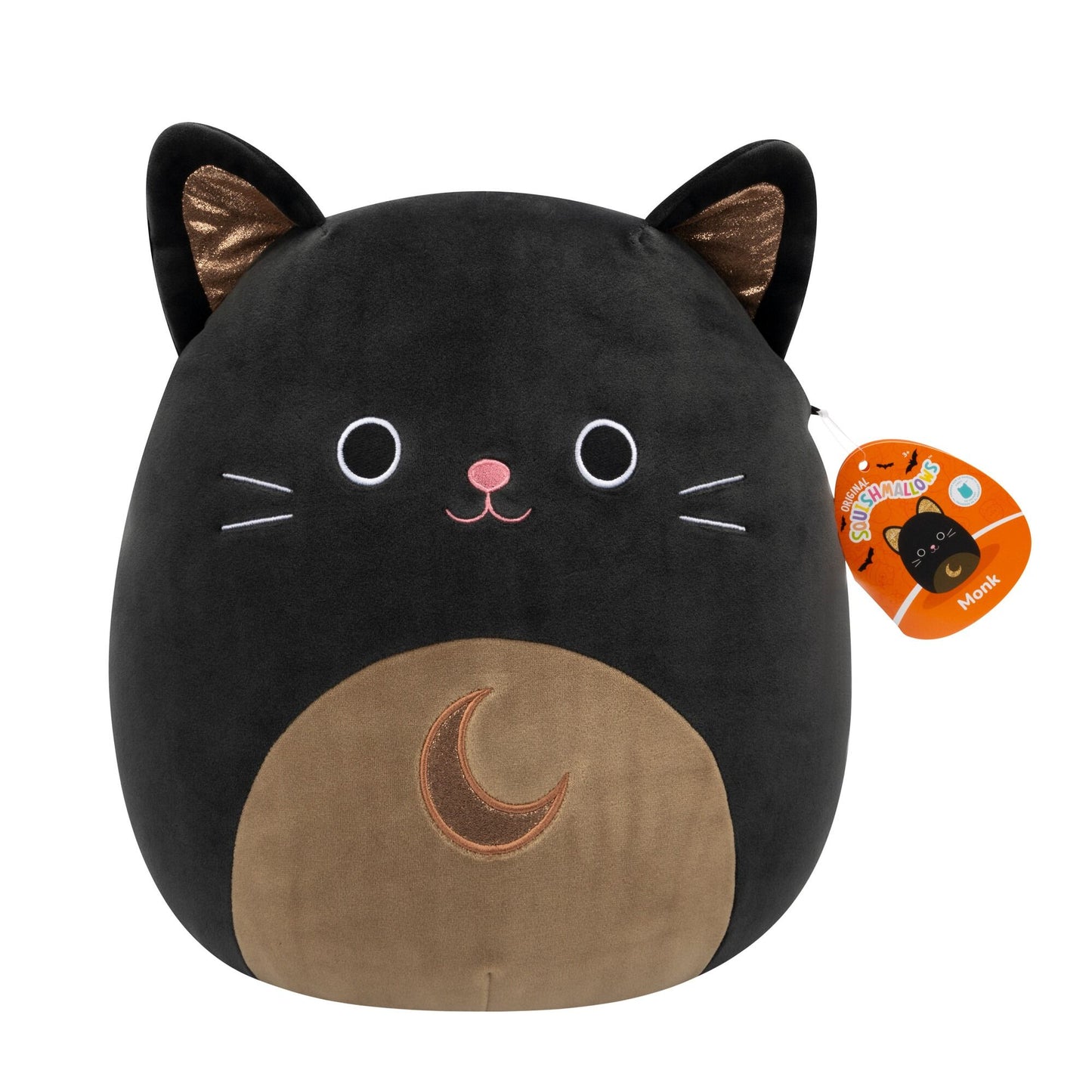 A black cat Squishmallow with bronze inner ears, white embroidered eyes, pink nose, whiskers, and a brown belly with a crescent moon, shown with its attached product tag
