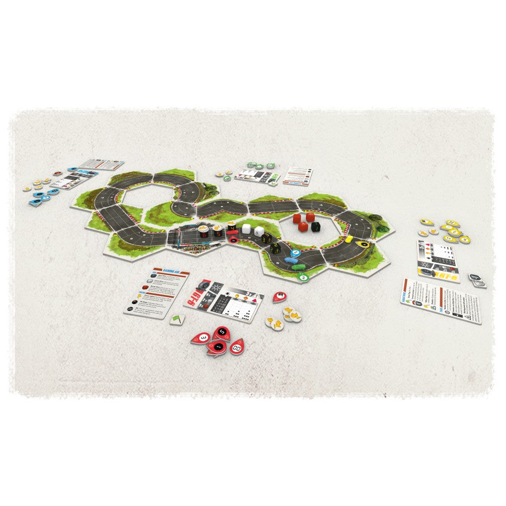 Rallyman GT board game set up with a modular hexagonal race track, several small cars, dice, and game cards on a light surface