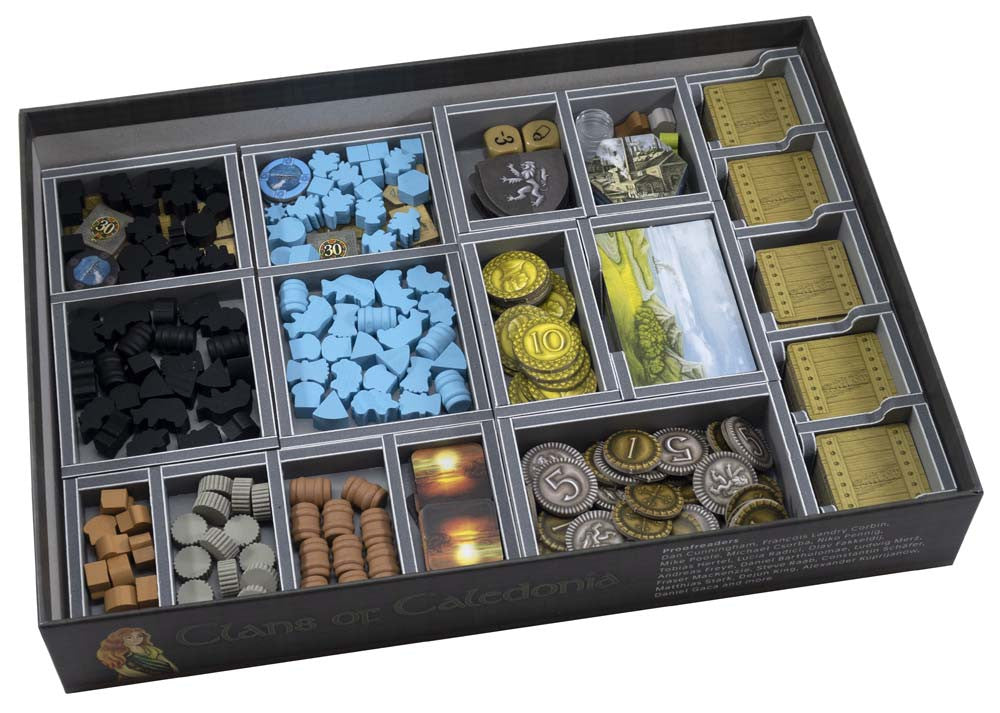 Folded Space Clans of Caledonia insert showing organized game components