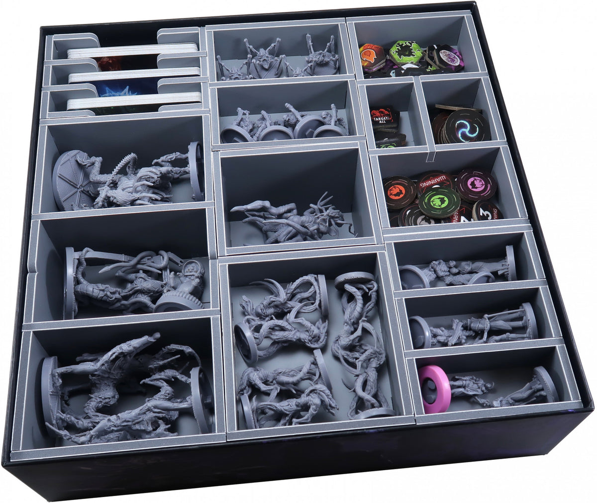 Top-down view of the insert showing compartments filled with cards and tokens