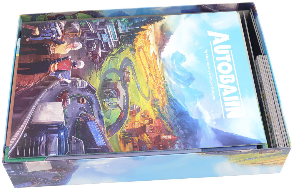 Close-up of game components organized inside the insert tray