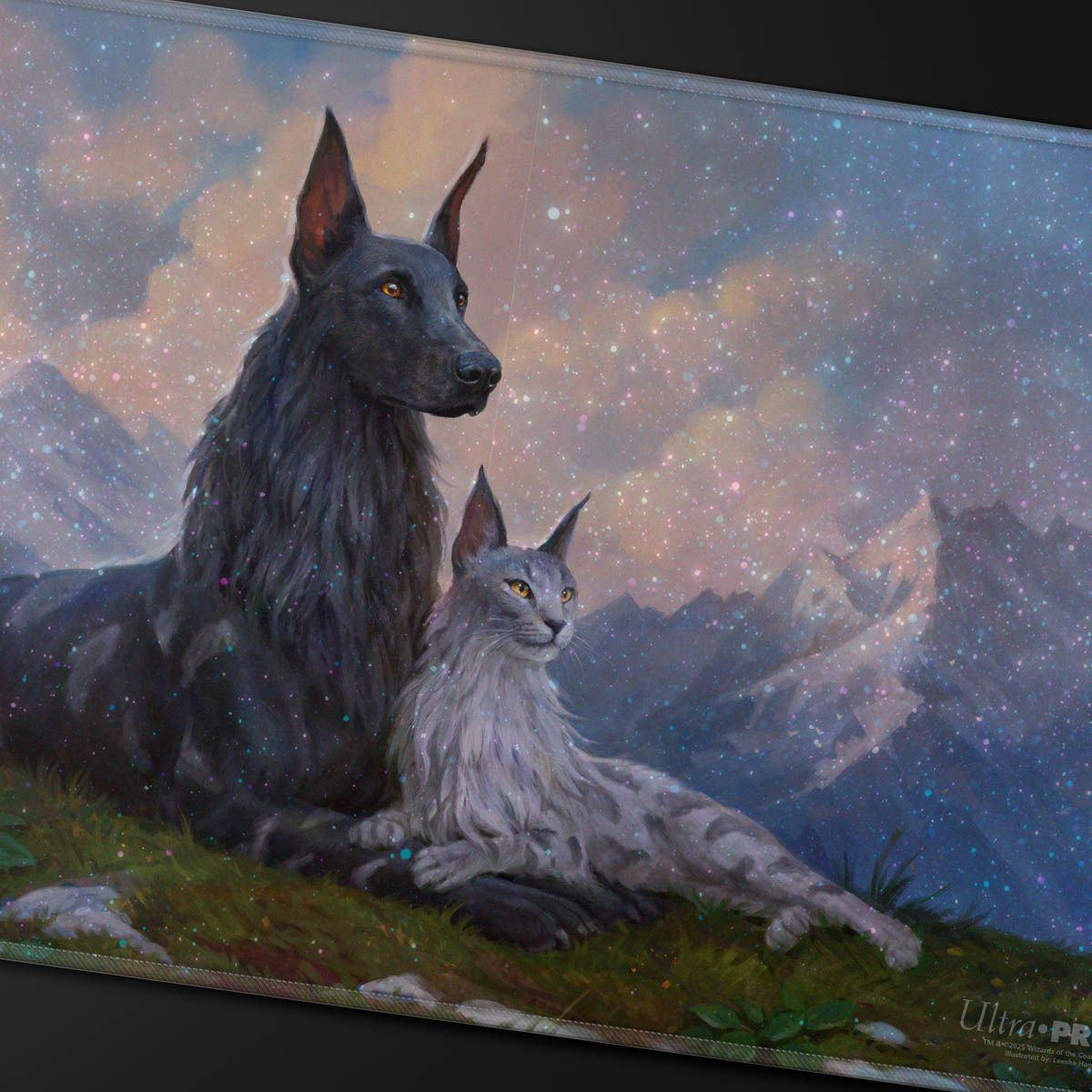 A black dog sits beside a grey cat lying on a grassy hill, against a cosmic sky with distant mountains