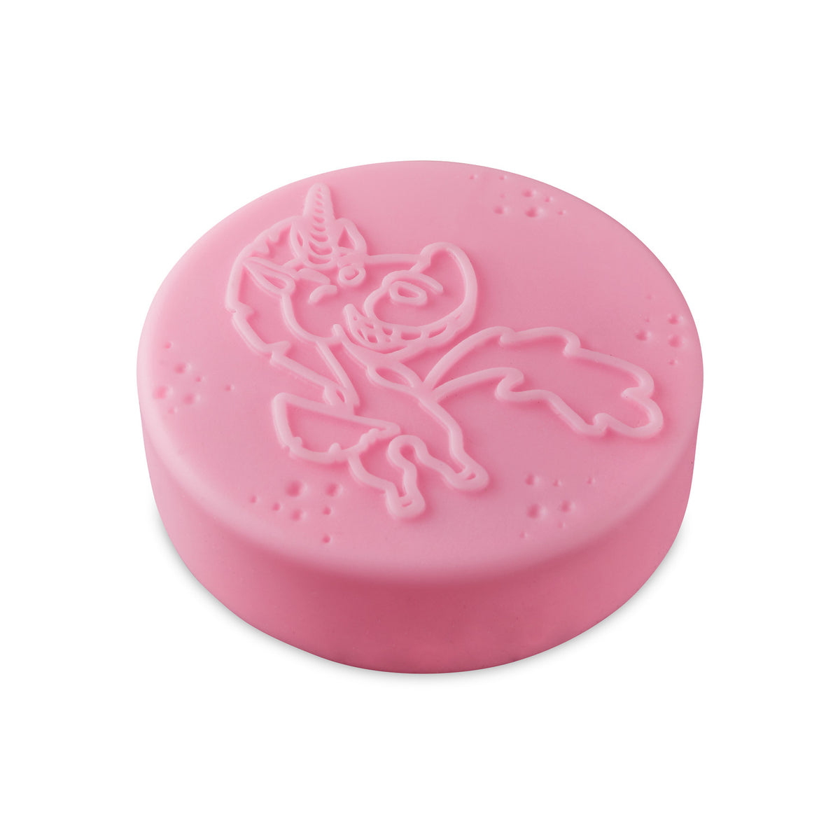 Pink circular bath bomb with a raised unicorn design and small scattered bubbles